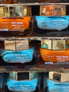 Lok E45 face cream jars in classic blue and Carrot White orange for dark spots