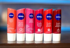 Nivea lip balm Fruity Shine tinted lip care tubes in various flavors for soft lips
