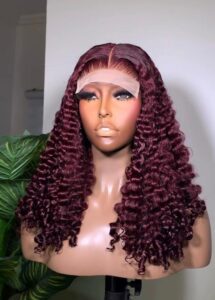 18-inch Burgundy Pixie Curls human hair wig with a 5x5 Swiss lace closure on a mannequin.