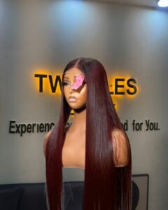 24-inch Super Double Drawn Burgundy Vietnamese Bone Straight human hair wig with a dark root and a 2x6 Swiss lace closure.