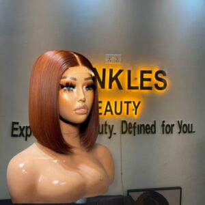 10-inch Super Double Drawn Ginger Brown Vietnamese Bone Straight human hair bob wig with a 2x6 Swiss lace closure.