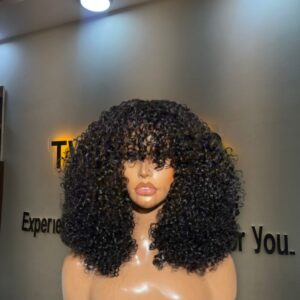 12-inch natural black Chinese pixie curls human hair wig styled into a voluminous rounded bob with full curly fringe bangs.