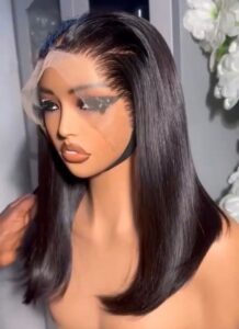 12-inch Super Double Drawn natural black Vietnamese bone straight human hair lob wig with an ear-to-ear 13x4 Swiss lace frontal on a showroom mannequin.