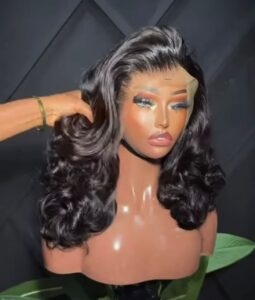 14-inch premium raw Vietnamese bouncy wavy human hair wig styled with voluminous stacked Hollywood curls on an extra-deep 13x6 Swiss lace frontal.