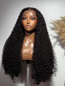 28-inch Super Double Drawn Natural Black Raw Pixie Curls wig with a 13x6 lace frontal on a mannequin.