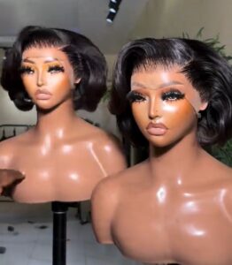 Super Double Drawn Natural Black SDD Tiwa wig with a 13x4 Swiss lace frontal and voluminous flipped-out ends.