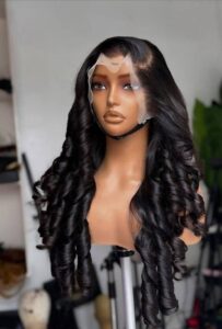 24-inch Super Double Drawn Natural Black Vietnam Bouncy hair wig with a 13x6 lace frontal and voluminous barrel curls.