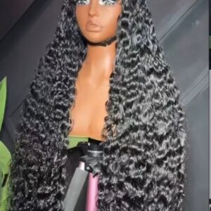 32-inch premium raw deep wave human hair wig styled with ultra-defined, high-volume wet look curls on a 5x5 Swiss lace closure.