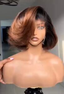 8-inch Super Double Drawn raw Vietnamese human hair frontal bob wig dyed a dark-rooted caramel honey brown, styled into a high-volume side-swoop curl.