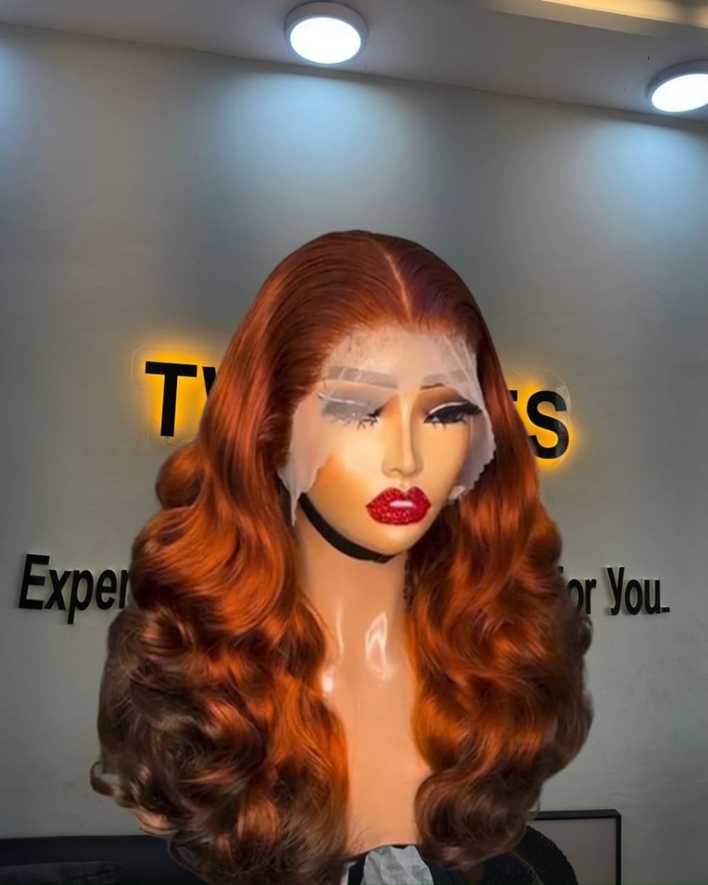18-inch Super Double Drawn Two Toned Cajun Chinese Wavy human hair wig with a 13x4 Swiss lace frontal and voluminous waves.
