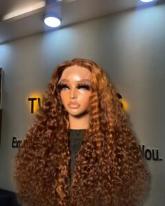 22-inch Super Double Drawn Piano Highlight Chinese Pixie Curls human hair wig with a 5x5 Swiss lace closure and high-volume curls.