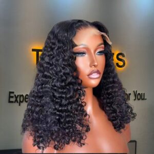 16-inch premium raw Burmese curly human hair wig featuring highly defined, springy deep corkscrew curls styled cleanly with a 5x5 Swiss lace closure.