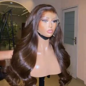 24-inch premium raw Vietnamese wavy human hair wig dyed a rich coffee brown color, styled with bouncing Hollywood layers and a 5x5 closure.