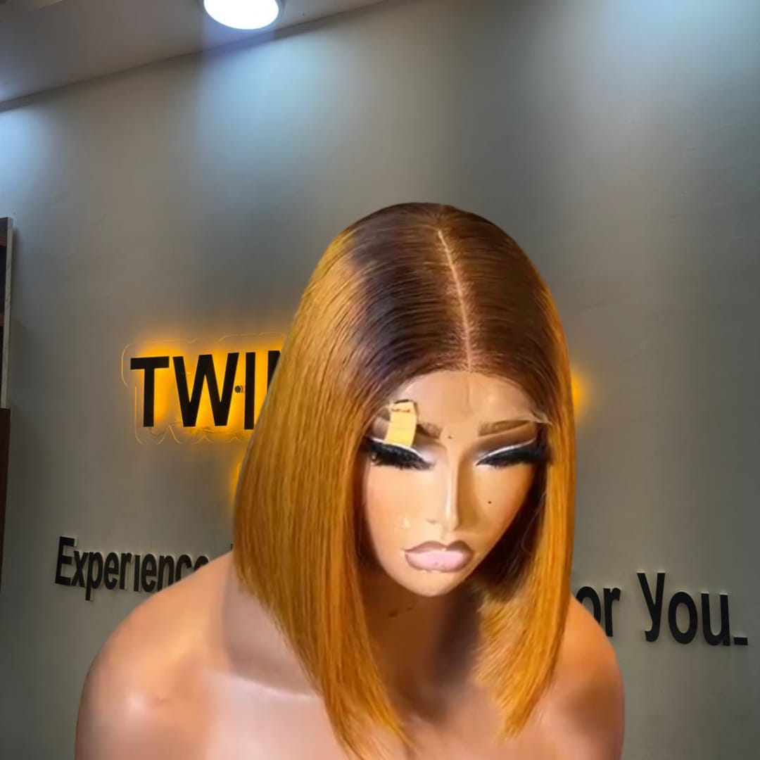 10-inch Super Double Drawn Yellowish Blonde Vietnamese Bone Straight human hair bob wig with a dark root and a 2x6 Swiss lace closure.