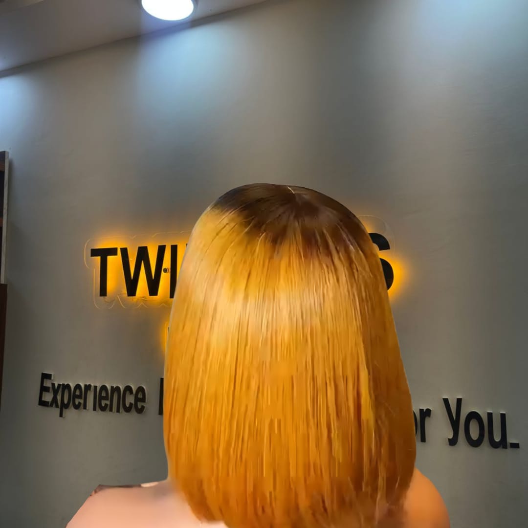 10-inch Super Double Drawn Yellowish Blonde Vietnamese Bone Straight human hair bob wig with a dark root and a 2x6 Swiss lace closure.